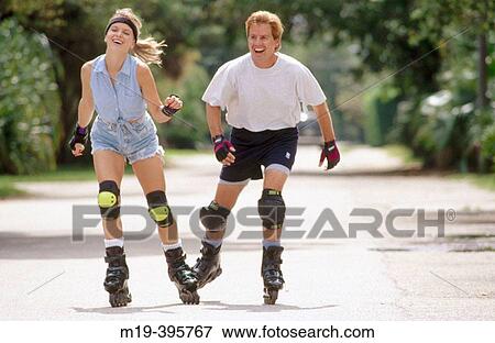 rollerblading couple View Large Photo Image Stock Photo - rollerblading couple. Fotosearch