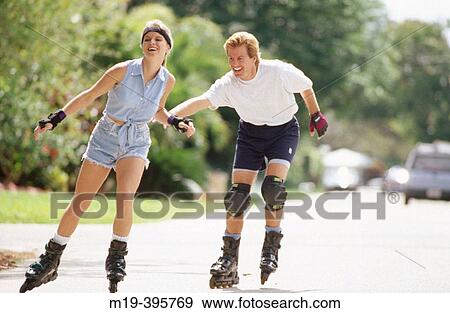 rollerblading couple View Large Photo Image Stock Photo - rollerblading couple. Fotosearch