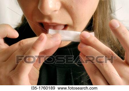 Rolling a cigarette View Large Photo Image Stock Photo - Rolling a cigarette. Fotosearch