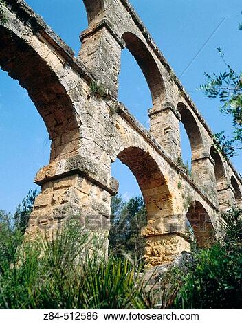 Roman aqueduct, also known as Pont del Diable (2th century A. D. ). Tarragona, Catalonia, Spain View Large Photo Image Stock Photograph - Roman aqueduct, also known as Pont del Diable (2th century A. D. ). Tarragona, Catalonia, Spain. Fotosearch