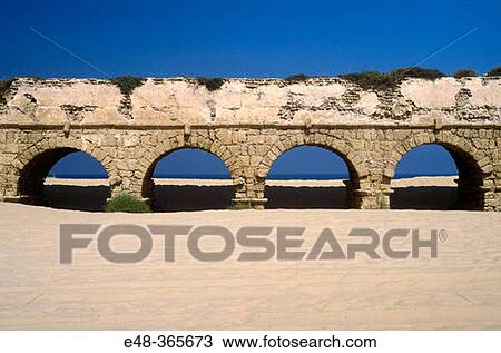 Stock Image - Roman aqueduct and beach, Caesarea (Hebrew? Horbat Qesari? ). Israel. Fotosearch