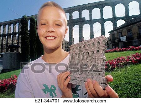 Stock Image - Roman aqueduct and souvenir. Segovia. Spain. Fotosearch