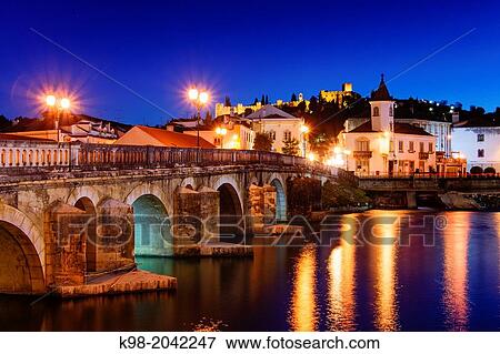 Stock Photo - Roman bridge over the river Nabao and Templar castle, Tomar, District of Santarem, Medio Tejo, region center, Portugal, Europe.. Fotosearch