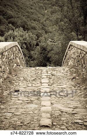 Roman bridge over the river Nalon, the Redes Natural Park, Asturias, Spain View Large Photo Image Stock Photo - Roman bridge over the river Nalon, the Redes Natural Park, Asturias, Spain. Fotosearch