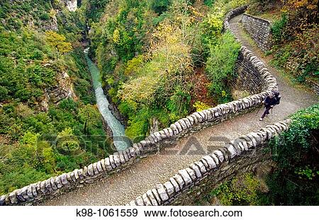 Stock Photo - Romanesque bridge over Bellos river, Valle de Aisclo, Huesca province, Aragon, Spain. Fotosearch