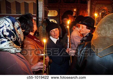 Stock Image - Romania, Moldavia Region, Southern Bucovina, Suceava, Easter Celebration, Candlelight mass, Easter Sunday, Orthodox Easter ceremony, St Ressurection church. Fotosearch
