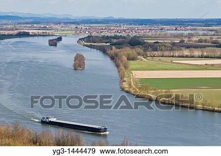 Romanian cargo ship travels north on the Danube river near Regensburg, Germany View Large Photo Image Stock Photo - Romanian cargo ship travels north on the Danube river near Regensburg, Germany. Fotosearch