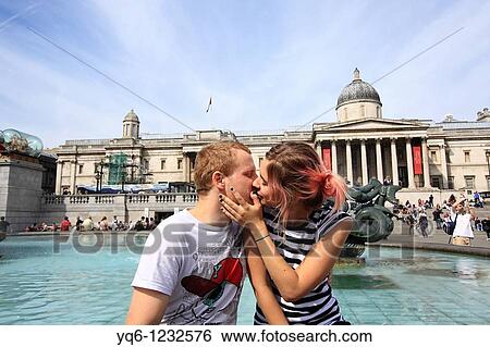 Stock Photograph - Romantic couple at Trafalgar Square, London. Fotosearch