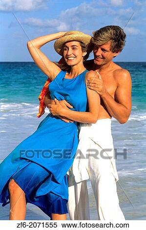 Romantic couple being playful at the beach. View Large Photo Image Stock Photography - Romantic couple being playful at the beach.. Fotosearch