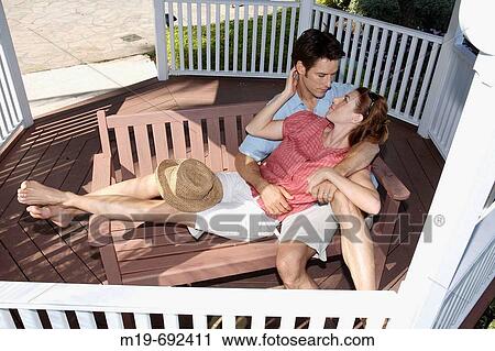 Stock Image - Romantic couple in a Gazebo. Fotosearch