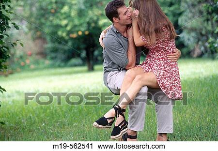 romantic couple on a rope swing View Large Photo Image Stock Image - romantic couple on a rope swing. Fotosearch