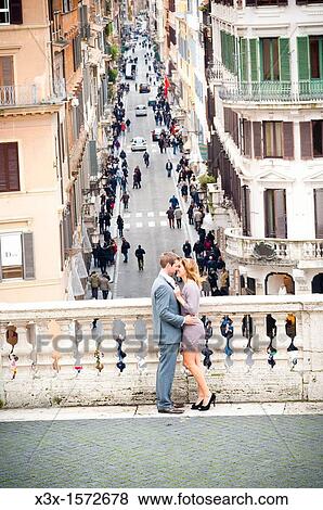 Stock Photo - Romantic couple standing on the terrace by the Spanish steps in Rome Italy. Fotosearch