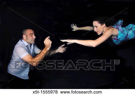 Romantic couple underwater View Large Photo Image Stock Photo - Romantic couple underwater. Fotosearch