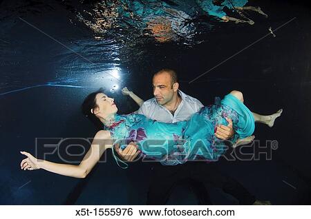Romantic couple underwater View Large Photo Image Stock Photograph - Romantic couple underwater. Fotosearch