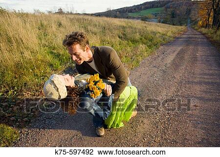 Romantic embrace on country road View Large Photo Image Stock Image - Romantic embrace on country road. Fotosearch