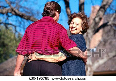 Romantic mature couple walking together outdoors View Large Photo Image Stock Photography - Romantic mature couple walking together outdoors. Fotosearch