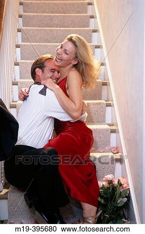 romantic, well dressed couple on the stairs View Large Photo Image Stock Image - romantic, well dressed couple on the stairs. Fotosearch