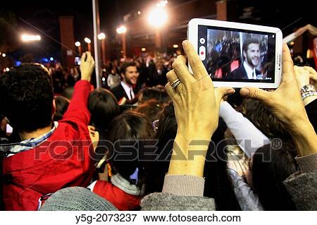 Rome, Italy. 14th Nov, 2013 Fans waiting for Jennifer Lawrence, Liam Hemsworth and Josh Hutcherson on the red carpet for the movie Hunger Games at the Rome International Film Festival at the Auditorium in Rome, Italy View Large Photo Image Stock Photo - Rome, Italy. 14th Nov, 2013 Fans waiting for Jennifer Lawrence, Liam Hemsworth and Josh Hutcherson on the red carpet for the movie Hunger Games at the Rome International Film Festival at the Auditorium in Rome, Italy. Fotosearch