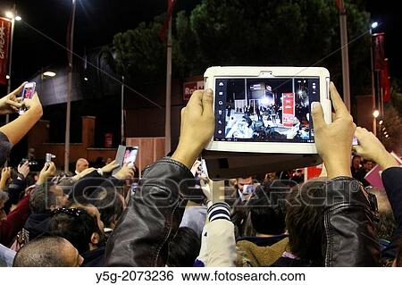 Rome, Italy. 14th Nov, 2013 Fans waiting for Jennifer Lawrence, Liam Hemsworth and Josh Hutcherson on the red carpet for the movie Hunger Games at the Rome International Film Festival at the Auditorium in Rome, Italy View Large Photo Image Stock Photograph - Rome, Italy. 14th Nov, 2013 Fans waiting for Jennifer Lawrence, Liam Hemsworth and Josh Hutcherson on the red carpet for the movie Hunger Games at the Rome International Film Festival at the Auditorium in Rome, Italy. Fotosearch