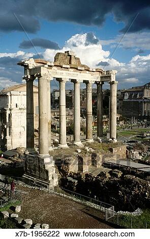 Stock Image - Rome. Italy. The Temple of Saturn, in the Roman Forum (Foro Romano).. Fotosearch