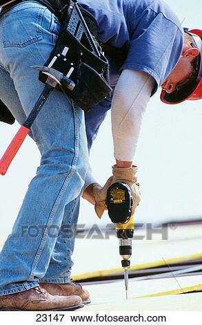 Roof construction worker View Large Photo Image Stock Photo - Roof construction worker. Fotosearch