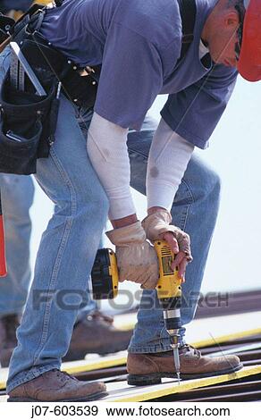 Roof construction worker View Large Photo Image Stock Photo - Roof construction worker. Fotosearch
