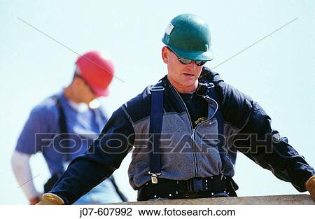 Roof construction workers View Large Photo Image Stock Image - Roof construction workers. Fotosearch