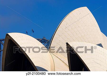 roof of Sydney Opera House framed against the peak of the Sydney Harbour Bridge. View Large Photo Image Stock Image - roof of Sydney Opera House framed against the peak of the Sydney Harbour Bridge.. Fotosearch