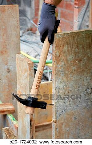 Roofing hammer, hand tools for construction, construction worker, Preparation of formwork for construction of pit with concrete, House Construction, Basque Country, Spain View Large Photo Image Stock Image - Roofing hammer, hand tools for construction, construction worker, Preparation of formwork for construction of pit with concrete, House Construction, Basque Country, Spain. Fotosearch