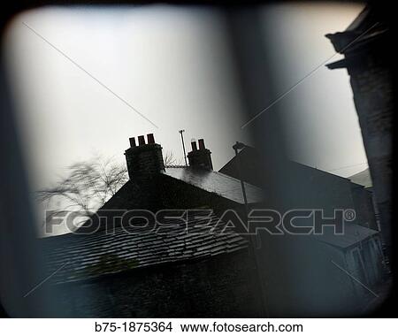 roofs with chimneys through a window in Yorkshire, England, UK View Large Photo Image Picture - roofs with chimneys through a window in Yorkshire, England, UK. Fotosearch