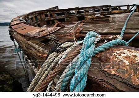 Ropes and cables hang from edge of abandoned fishing boat, near Salen, Isle of Mull, Scotland View Large Photo Image Stock Photograph - Ropes and cables hang from edge of abandoned fishing boat, near Salen, Isle of Mull, Scotland. Fotosearch