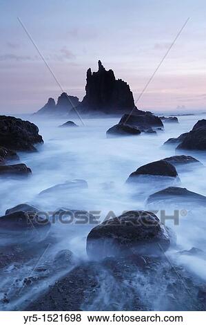 Roques de Benijo at sunrise from Benijo near Taganana in the Anaga region of Tenerife Canary Islands, Spain View Large Photo Image Stock Photo - Roques de Benijo at sunrise from Benijo near Taganana in the Anaga region of Tenerife Canary Islands, Spain. Fotosearch