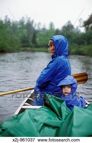 Roscommon, Michigan - Susan Newell and her daughter Mariel West, 3, on a canoe camping trip on the south branch of the Au Sable River View Large Photo Image Stock Photo - Roscommon, Michigan - Susan Newell and her daughter Mariel West, 3, on a canoe camping trip on the south branch of the Au Sable River. Fotosearch
