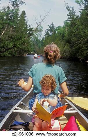 Roscommon, Michigan - Susan Newell and her daughter Mariel West, 3, on a canoe camping trip on the south branch of the Au Sable River View Large Photo Image Stock Photograph - Roscommon, Michigan - Susan Newell and her daughter Mariel West, 3, on a canoe camping trip on the south branch of the Au Sable River. Fotosearch