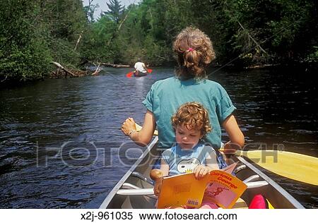 Roscommon, Michigan - Susan Newell and her daughter Mariel West, 3, on a canoe camping trip on the south branch of the Au Sable River View Large Photo Image Stock Photography - Roscommon, Michigan - Susan Newell and her daughter Mariel West, 3, on a canoe camping trip on the south branch of the Au Sable River. Fotosearch