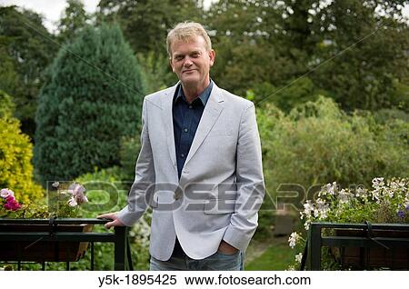 Rotterdam, Netherlands An accountant, working for small companies, in the garden behind his office. View Large Photo Image Stock Photography - Rotterdam, Netherlands An accountant, working for small companies, in the garden behind his office.. Fotosearch