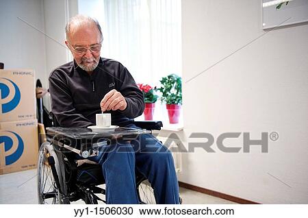Rotterdam, Netherlands. An older man with stroke rehabilitates, living from his wheelchair, in a nursing home. View Large Photo Image Stock Image - Rotterdam, Netherlands. An older man with stroke rehabilitates, living from his wheelchair, in a nursing home.. Fotosearch
