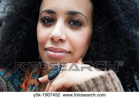 Rotterdam, Netherlands. Portrait or headshot of a young African woman, looking directly into the camera. View Large Photo Image Stock Image - Rotterdam, Netherlands. Portrait or headshot of a young African woman, looking directly into the camera.. Fotosearch
