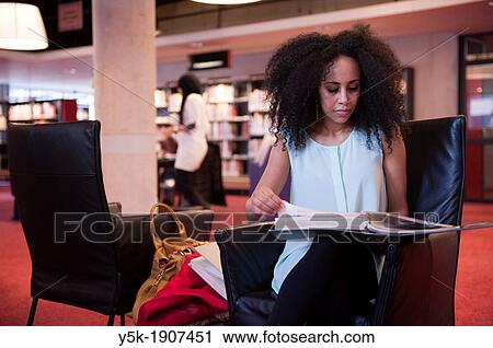 Rotterdam, Netherlands. Young, African woman reading educational literature about photography in a public Library. View Large Photo Image Stock Image - Rotterdam, Netherlands. Young, African woman reading educational literature about photography in a public Library.. Fotosearch