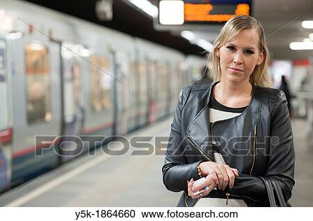 Rotterdam, Netherlands. Young, fashionable blonde waiting for subway-train. View Large Photo Image Stock Image - Rotterdam, Netherlands. Young, fashionable blonde waiting for subway-train.. Fotosearch