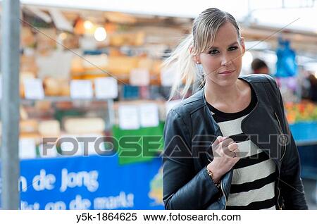 Rotterdam, Netherlands. Young, attractive woman in tuesday market. View Large Photo Image Stock Photography - Rotterdam, Netherlands. Young, attractive woman in tuesday market.. Fotosearch