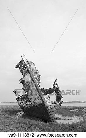 Rotting fishing boat on the sandbanks of the River Wyre estuary in Lancashire, England, UK View Large Photo Image Stock Image - Rotting fishing boat on the sandbanks of the River Wyre estuary in Lancashire, England, UK. Fotosearch