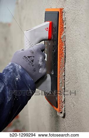 Roughcast, grout float, new homes under construction, construction site View Large Photo Image Picture - Roughcast, grout float, new homes under construction, construction site. Fotosearch
