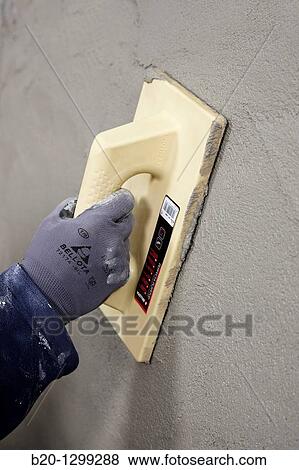 Stock Photo - Roughcast, grout float, new homes under construction, construction site. Fotosearch