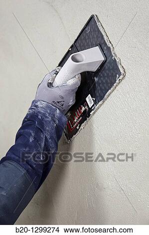 Roughcast, plastering trowel, new homes under construction, construction site View Large Photo Image Picture - Roughcast, plastering trowel, new homes under construction, construction site. Fotosearch