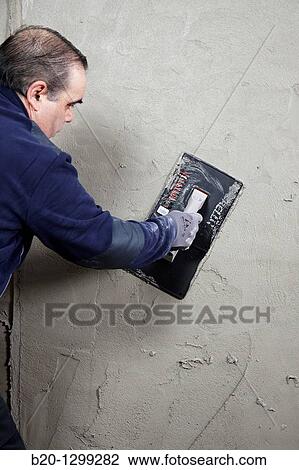 Roughcast, plastering trowel, new homes under construction, construction site View Large Photo Image Stock Image - Roughcast, plastering trowel, new homes under construction, construction site. Fotosearch