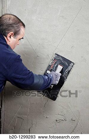 Roughcast, plastering trowel, new homes under construction, construction site View Large Photo Image Stock Image - Roughcast, plastering trowel, new homes under construction, construction site. Fotosearch