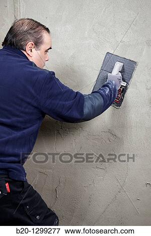 Roughcast, plastering trowel, new homes under construction, construction site View Large Photo Image Stock Photo - Roughcast, plastering trowel, new homes under construction, construction site. Fotosearch