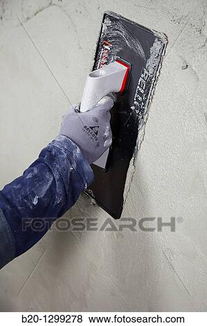 Roughcast, plastering trowel, new homes under construction, construction site View Large Photo Image Stock Photo - Roughcast, plastering trowel, new homes under construction, construction site. Fotosearch