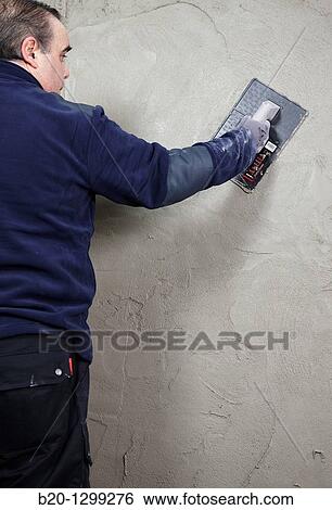 Roughcast, plastering trowel, new homes under construction, construction site View Large Photo Image Stock Photograph - Roughcast, plastering trowel, new homes under construction, construction site. Fotosearch